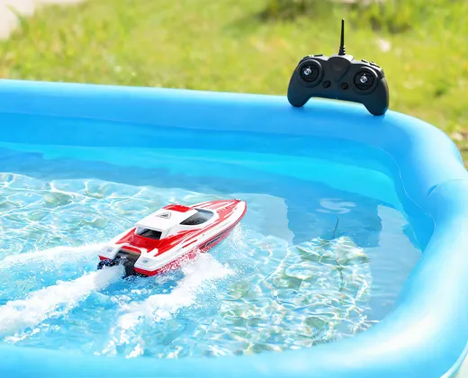 RC boat gliding in a shallow pool