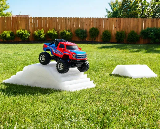 RC truck running over small ramps